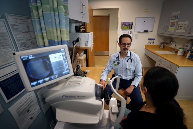 Doctor works with patient in hospital