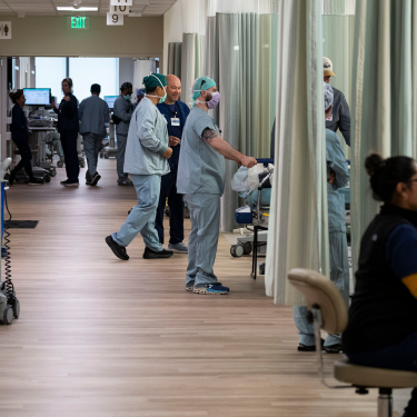 Surgeons prepare for surgery in the hallways of a clinic