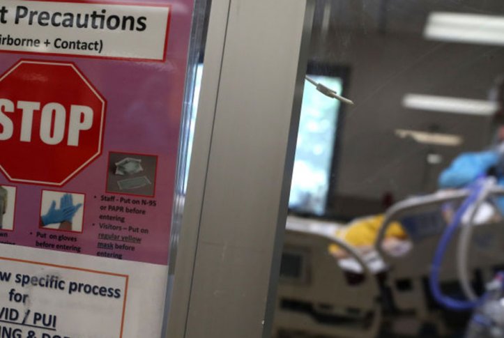 COVID-19 precautions sign in a hospital