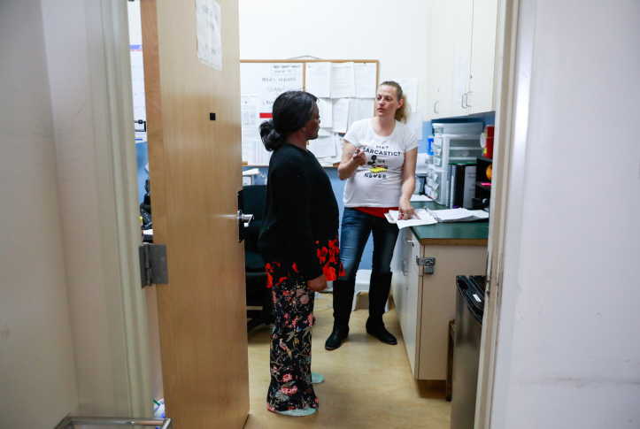 Two women talk in clinic room