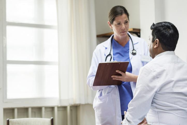 Doctor examines patient covered under Medicaid