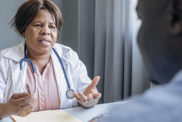 doctor talks to patients about costs