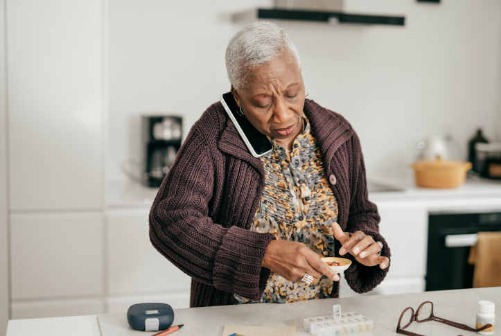 Woman on phone with meds