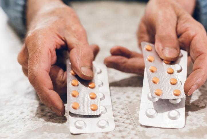 Man-choosing-between-brand-name-drugs-and-generic-drugs