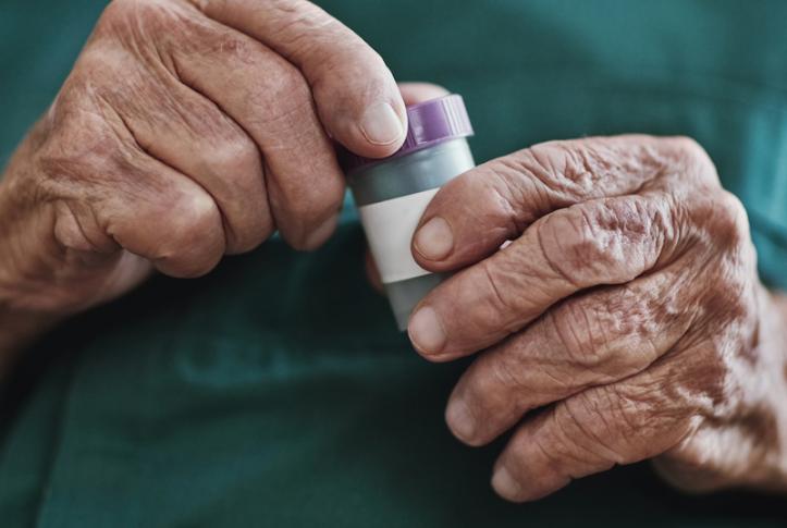 senior opens medications