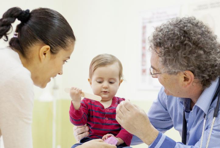 baby at pediatrician getting health checkup 