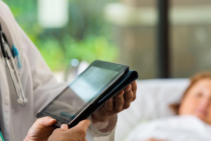 Doctors use electronic health records with patient