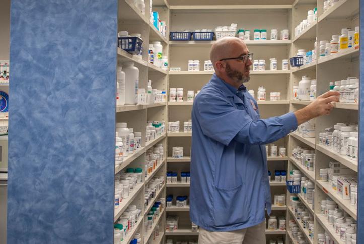 pharmacist choosing medications for patient