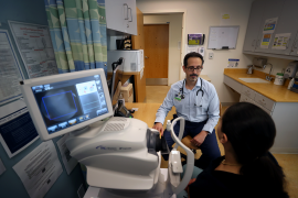 Doctor works with patient in hospital